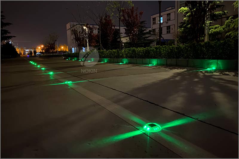 green-solar-road-stud-on-road